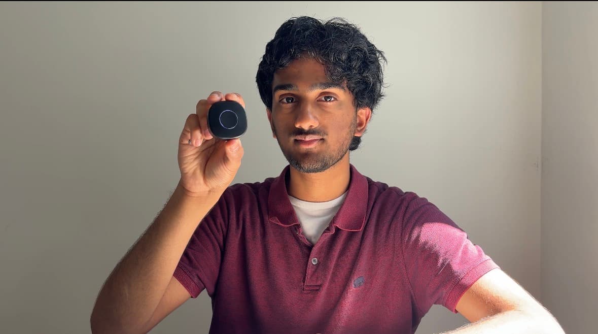 Ashwin Chunchu holding a StepSafe SS-01 tracker